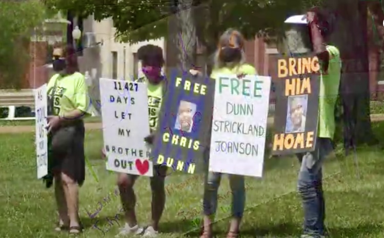 Supporters of Christopher Dunn, Lamar Johnson, and Kevin Strickland rally at the Missouri capitol.